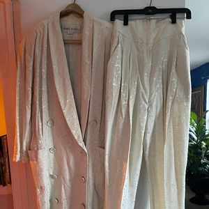 Norma Kamali coat dress with high waisted slacks